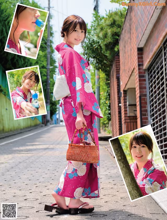 A woman in a pink kimono is walking down the street.